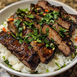 Grilled Vietnamese beef short ribs served with fresh herbs and rice.